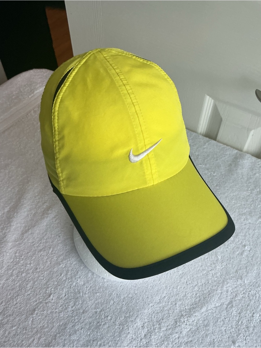 Nike Featherlight Dri-fit Bright Yellow Sports Cap with White Swoosh.